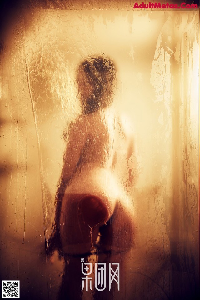 A poster for a movie with a woman standing in front of a window.
